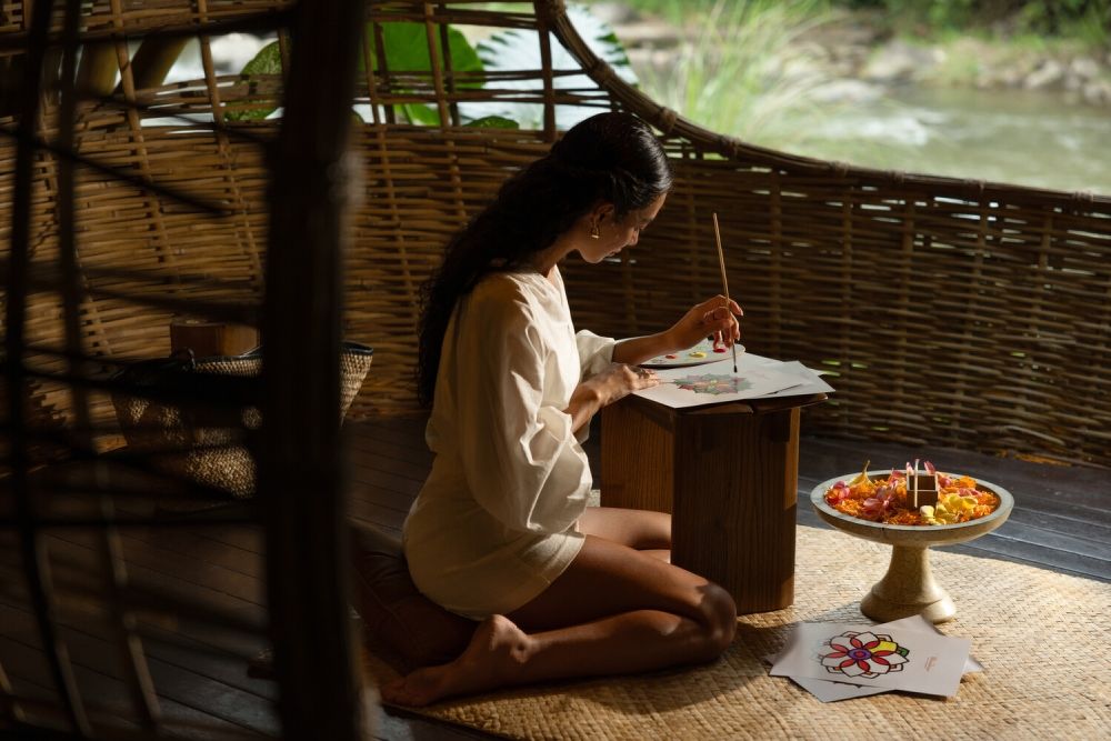 A young woman painting in a luxury resort