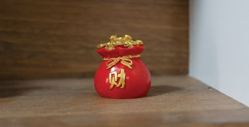 Figurine of a traditional Chinese lucky red pouch