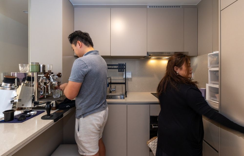 The couple in the kitchen of the Seaside Residences condo unit