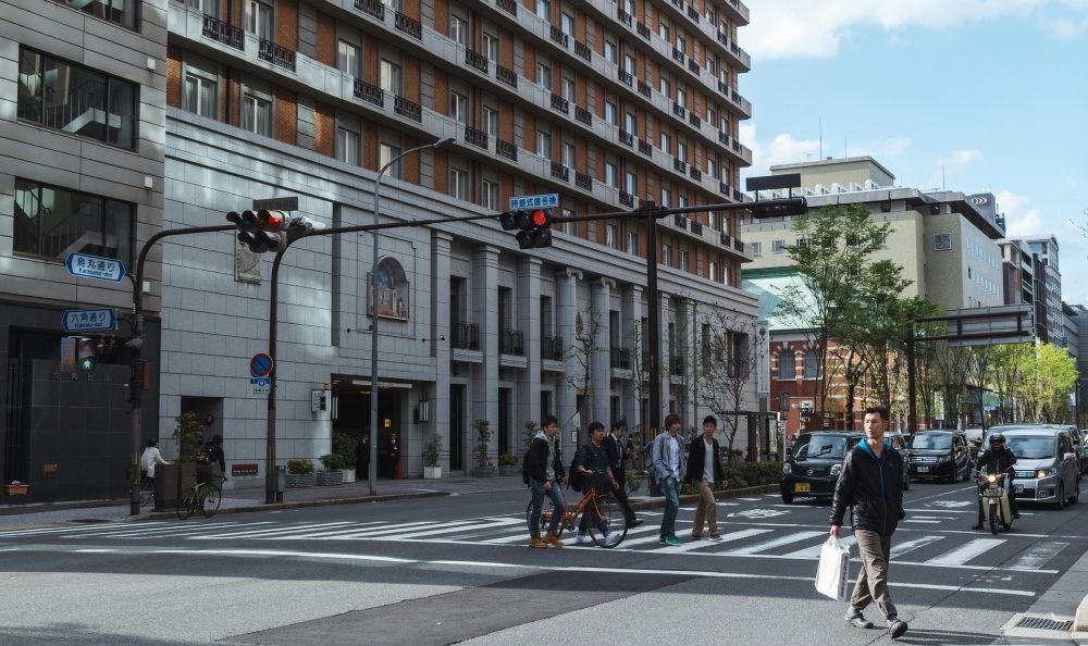 Pedestrians and buildings in Kyoto, Japan.