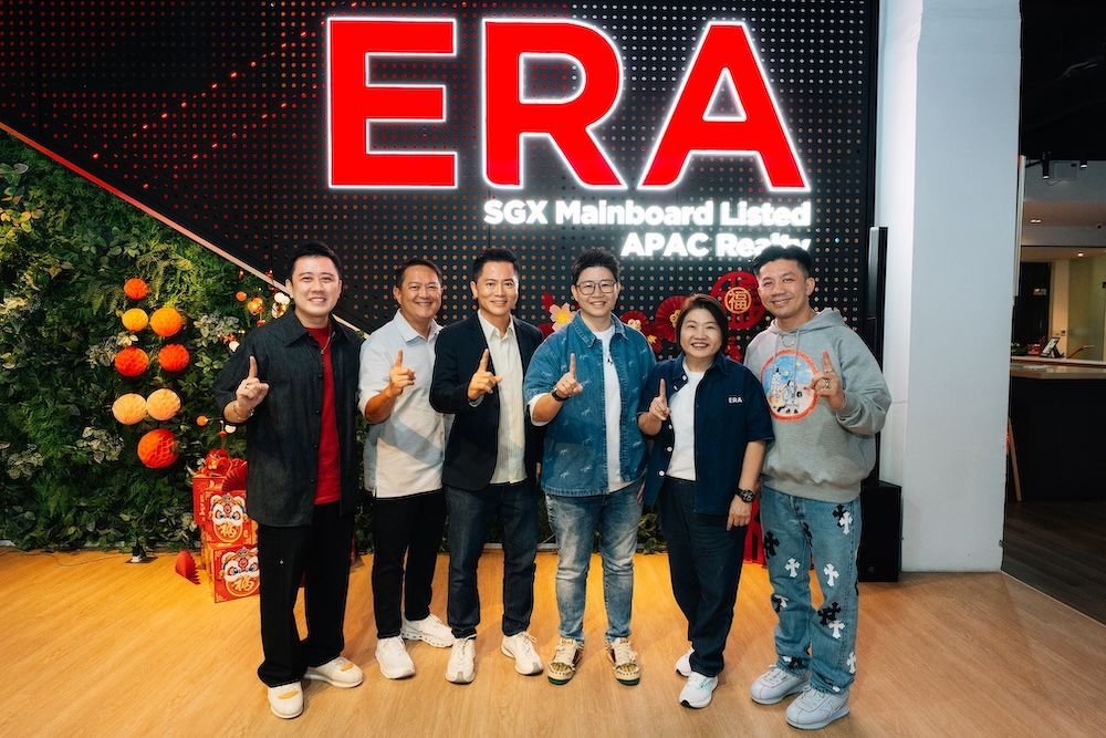 Top property agent Rayne Chua with the ERA Singapore leadership team