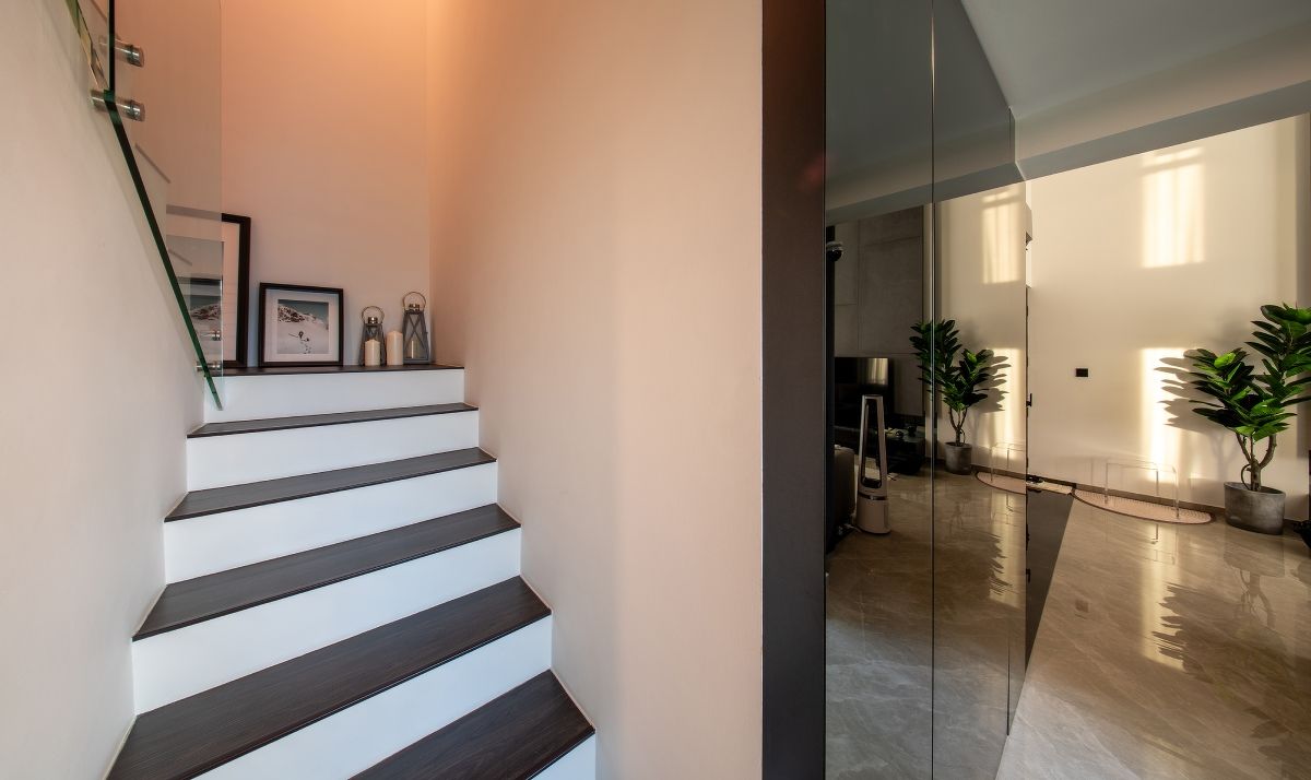 The staircase next to the living area of the Punggol apartment