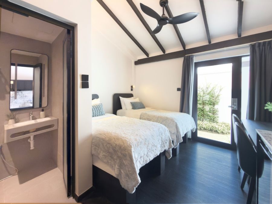 Room interior with beds, at Coliwoo Resort Changi