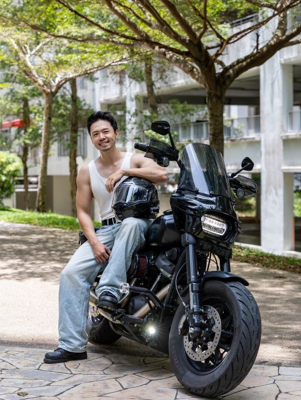 Photo of Jerome Yap, a real estate agent in Singapore, with his Harley-Davidson bike