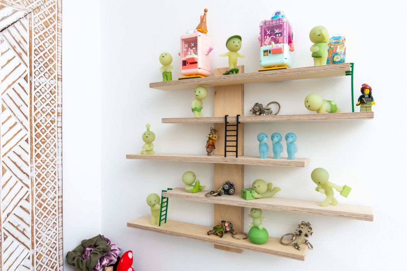 Glow-in-the-dark Smiski toy collectibles and a Lego Minifigure, among other knick knacks