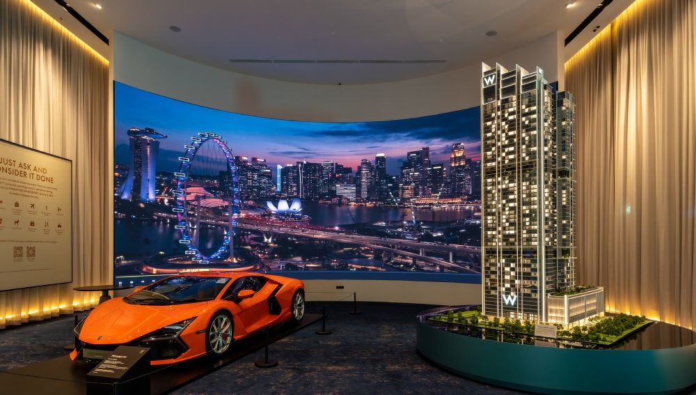 The sales gallery at W Residences Marina View - Singapore, with a car and scale model