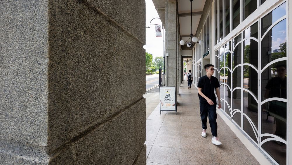 Frontage with passerby at Temasek Shophouse