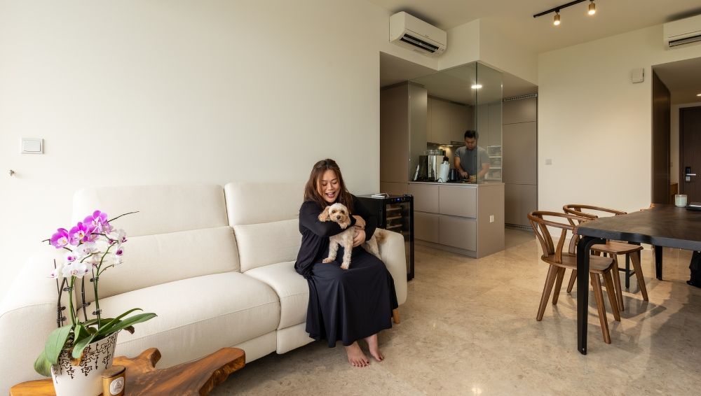 Claire, Wayne and their dog - interior of the resale unit at Seaside Residences