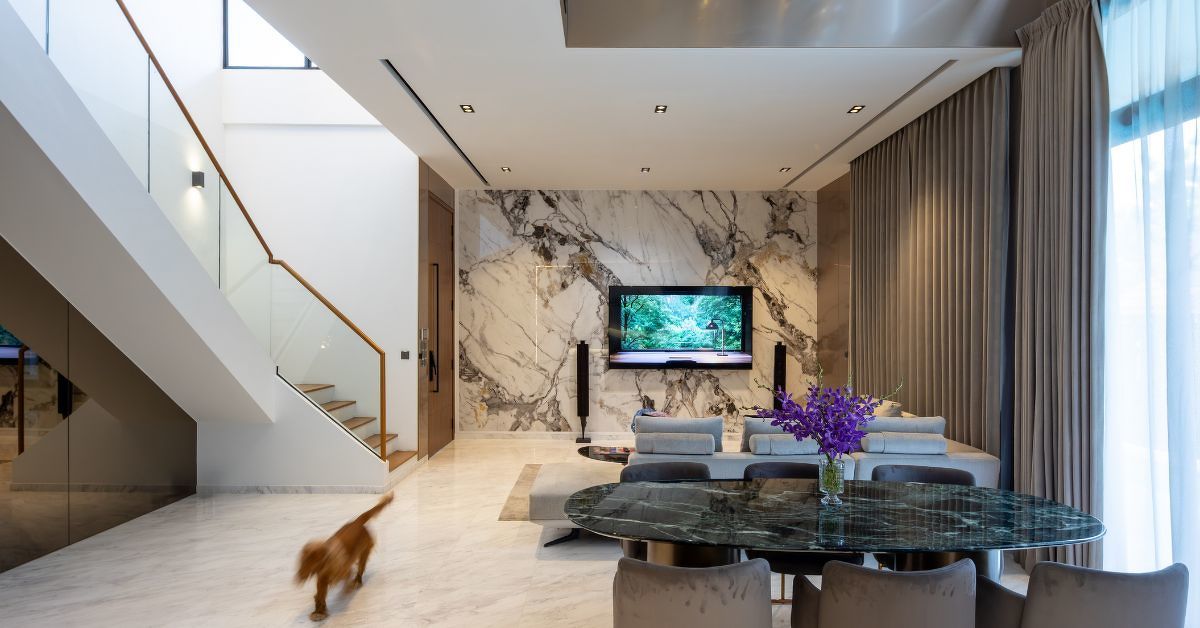 The open living and dining spaces allow the couple and their dogs to move easily through the home