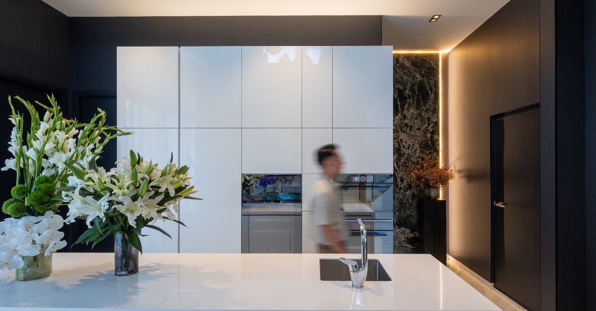 Clean lines, integrated appliances and a restrained palette contribute to the kitchen's understated aesthetic